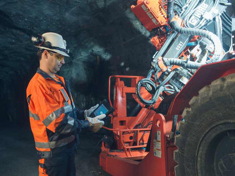 Operator using tablet underground